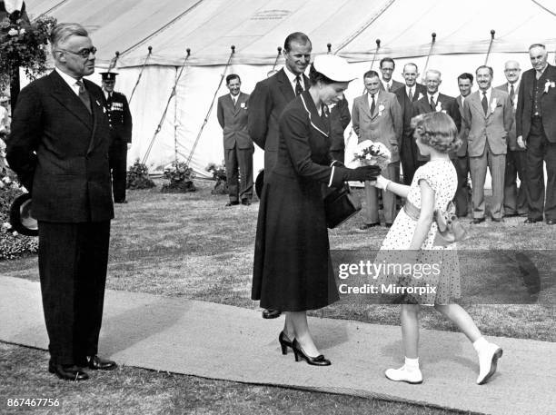 Queen Elizabeth II visiting Wales. The Queen with the Duke of Edinburgh and Councillor John de Winton, who is president of the Brecknockshire...