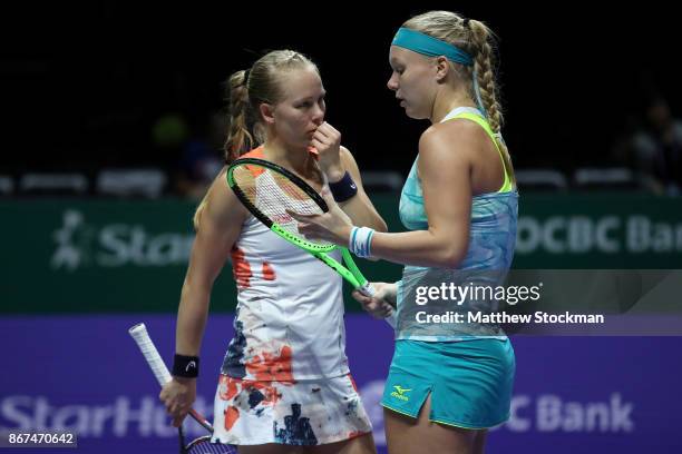 Kiki Bertens of Netherlands and Johanna Larsson of Sweden talk in the doubles semi final match against Elena Vesnina and Ekaterina Makarova of Russia...