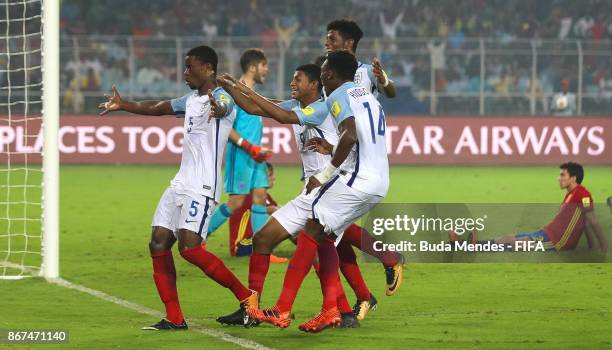 Marc Guehi of England celebrates with his teammates after scoring their fourth goal during the FIFA U-17 World Cup India 2017 Final match between...