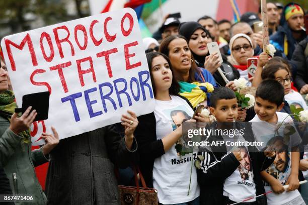 Prostesters wearing a tee-shirt bearing a portrait of Nasser Zefzafi - a key figure in the Morocco's Al-Hirak al-Shaabi movement that called for...