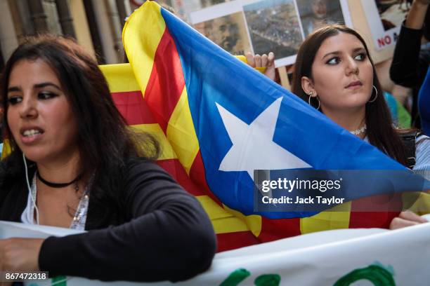 Moroccan Rif activists carry a Catalan independence flag during a demonstration outside the Catalan Government building, the Palau de la Generalitat...