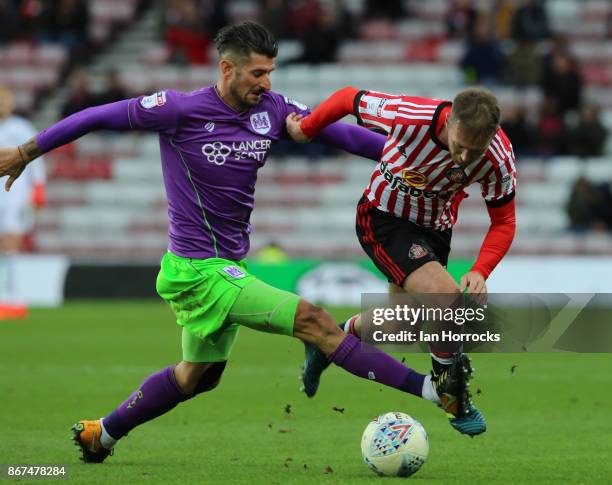 Eros Pisano of Bristol tries to halt Aiden McGeady of Sunderland during the Sky Bet Championship match between Sunderland and Bristol City at Stadium...