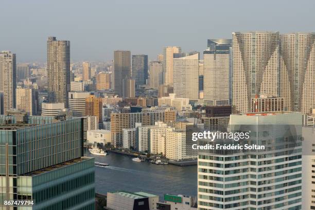 Aerial view in Tokyo and its Tower from the World Trade Center Building, a 40-story commercial skyscraper located in Hamamatsucho, Minato on MARCH...