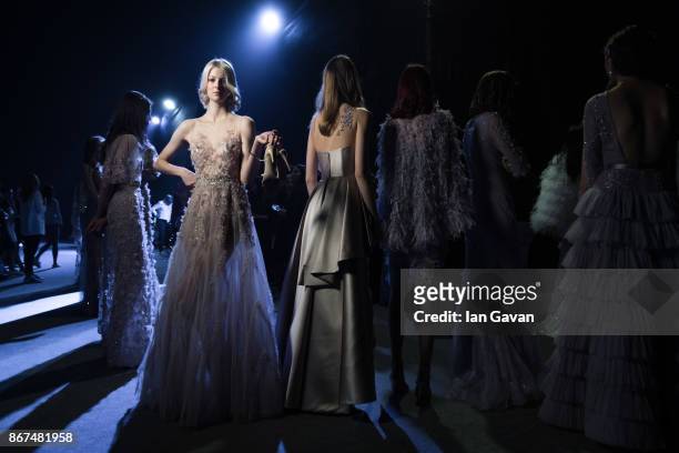 Models backstage ahead of the Joao Rolo International show during Fashion Forward October 2017 held at the Dubai Design District on October 28, 2017...