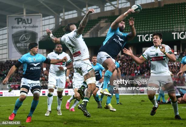 Montpellier's French hooker Romain Ruffenach jumps to grab the ball during the French Top 14 rugby union match between Pau and Montpellier at the...