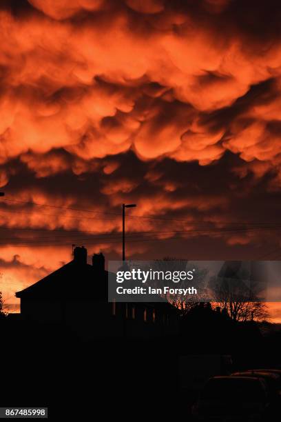 Mammatus clouds form over houses at sunset on October 28, 2017 in Saltburn-by-the-Sea, England. Mammatus means mammary cloud and they are a cellular...