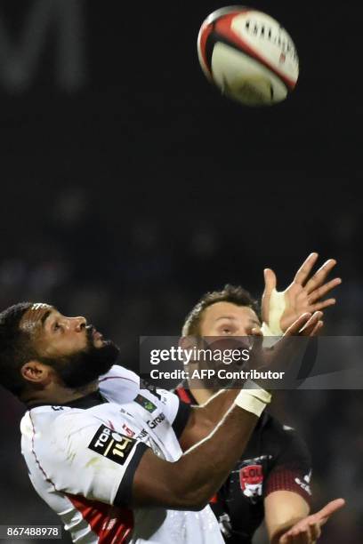 Oyonnax' French wing Daniel Ikpefan vies with Lyon's French fly-half Lionel Beauxis during the French Top 14 rugby union match Lyon vs Oyonnax on...