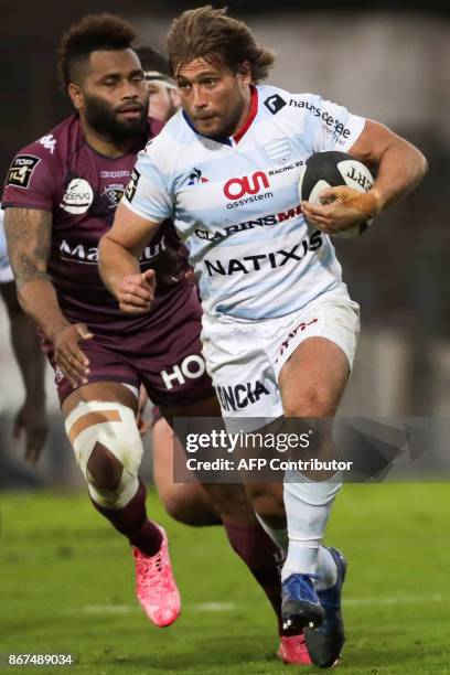 Racing-Metro's hooker Dimitri Szarzewski runs with the ball during the French Top 14 rugby union match between Racing Metro 92 and Union...