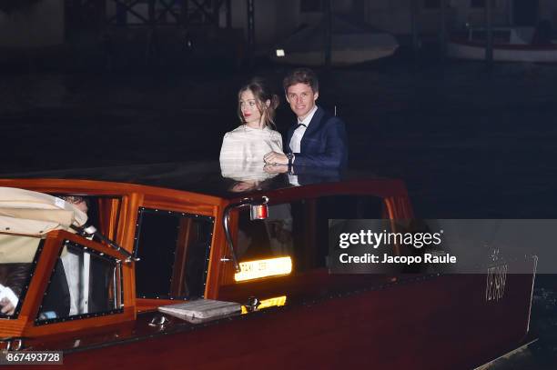 Hannah Bagshawe and Eddie Redmayne arrive at OMEGA Aqua Terra Palazzo Pisani Moretta on October 28, 2017 in Venice, Italy.