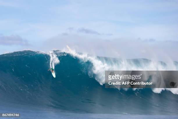 Ian Walsh from Maui, HI, rides a big wave at Jaws , off the coast of the Maui Island in Hawaii on the first day of the Pe'ahi Challenge 2017, on...