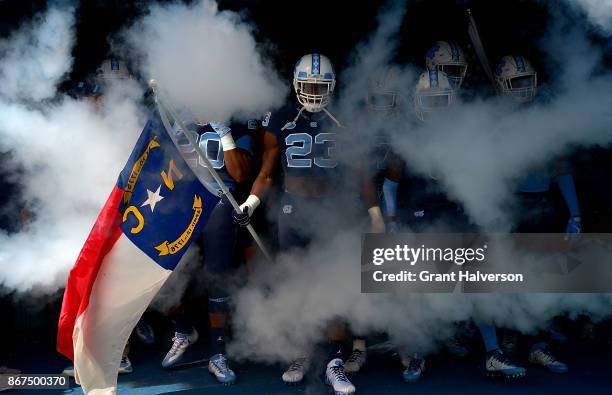 Cayson Collins of the North Carolina Tar Heels prepares to lead the team onto the field during their game against the Miami Hurricanes at Kenan...