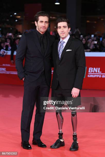 Jake Gyllenhaal and Jeff Bauman walk a red carpet for 'Stronger' during the 12th Rome Film Fest at Auditorium Parco Della Musica on October 28, 2017...