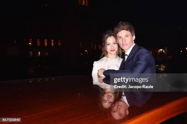 Hannah Bagshawe and Eddie Redmayne arrive at OMEGA Aqua Terra Palazzo Pisani Moretta on October 28, 2017 in Venice, Italy.