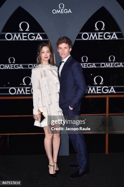 Hannah Bagshawe and Eddie Redmayne attend the OMEGA Aqua Terra at Palazzo Pisani Moretta on October 28, 2017 in Venice, Italy.