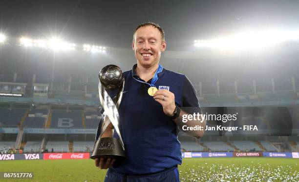 England manager Steve Cooper celebrates with the trophy during the FIFA U-17 World Cup India 2017 Final match between England and Spain at...