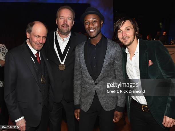 Members Bobby Bradock and Don Schlitz with Singer/Songwriters Aloe Blacc and Charlie Worsham attend the Country Music Hall Of Fame And Museum...