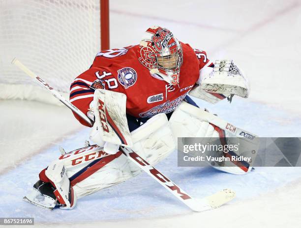 Kyle Keyser of the Oshawa Generals watches the puck during an OHL game against the Niagara IceDogs at the Meridian Centre on October 26, 2017 in St...