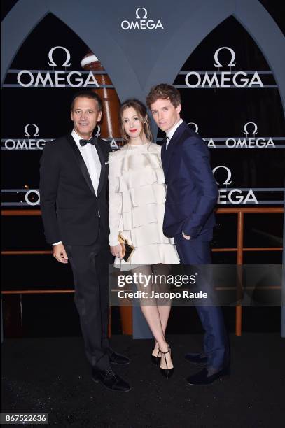 Raynald Aeschlimann, Hannah Bagshawe and Eddie Redmayne attend the OMEGA Aqua Terra at Palazzo Pisani Moretta on October 28, 2017 in Venice, Italy.