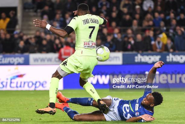 Angers' Cameroonese forward Karl Toko Ekambi vies with Strasbourg's French defender Yoann Salmier during the French L1 football match between...