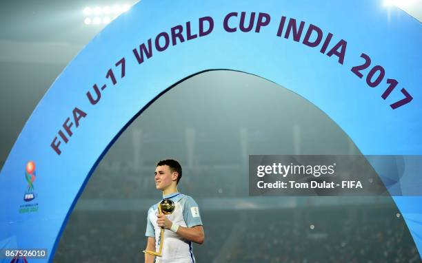 Philip Foden poses with Man of the Tournament trophy after the FIFA U-17 World Cup India 2017 Final match between England and Spain at Vivekananda...