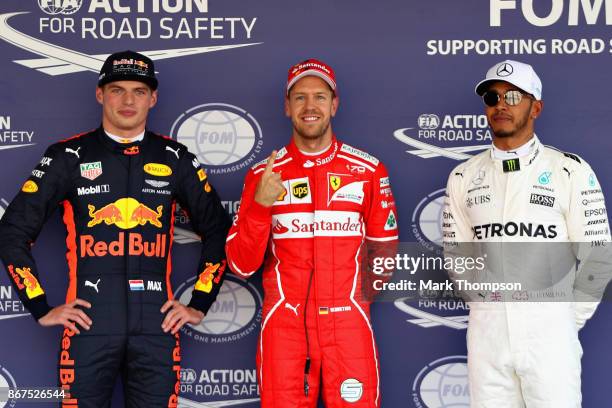 Top three qualifiers Sebastian Vettel of Germany and Ferrari, Max Verstappen of Netherlands and Red Bull Racing and Lewis Hamilton of Great Britain...