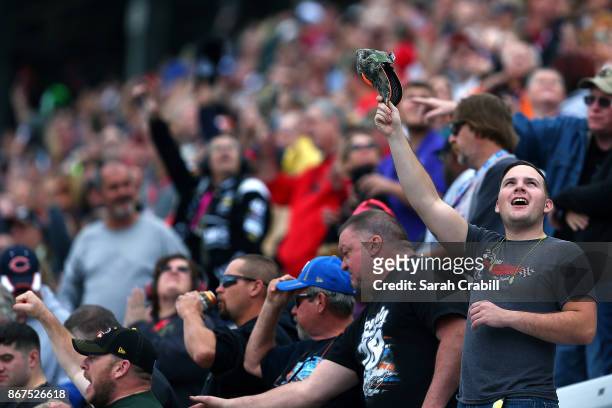 Fans cheer during the NASCAR Camping World Truck Series Texas Roadhouse 200 at Martinsville Speedway on October 28, 2017 in Martinsville, Virginia.