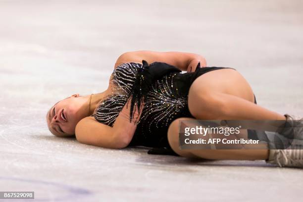 Anna Pogorilaya of Russia lies on the ice after a hard fall during her free program at the 2017 Skate Canada International ISU Grand Prix event in...