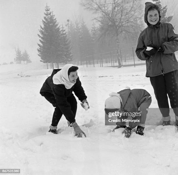 Rita Hayworth on holiday at Megeve in the French Alps with her daughters Yasmin and Rebecca, 30th January 1956.