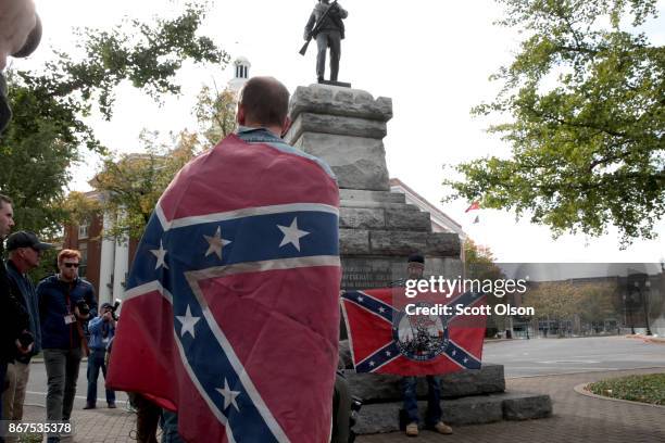 People hold Confederate flags during a "White Lives Matter" rally on October 28, 2017 in Murfreesboro, Tennessee. Tennessee Gov. Bill Haslam said...