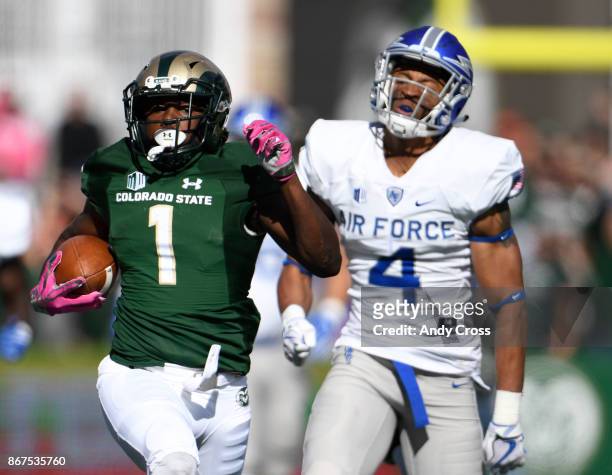 Colorado State Rams running back Dalyn Dawkins eludes Air Force Falcons defensive back James Jones for a 76-yard touchdown run in the first quarter...
