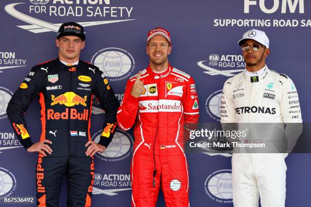 Top three qualifiers Sebastian Vettel of Germany and Ferrari, Max Verstappen of Netherlands and Red Bull Racing and Lewis Hamilton of Great Britain...