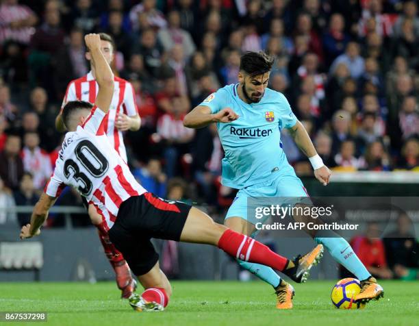 Barcelona's Portuguese midfielder Andre Gomes vies with Athletic Bilbao's Spanish defender Unai Nunez during the Spanish league football match...