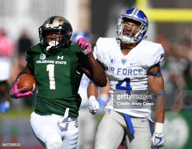 Colorado State Rams running back Dalyn Dawkins eludes Air Force Falcons defensive back James Jones for a 76-yard touchdown run in the first quarter...