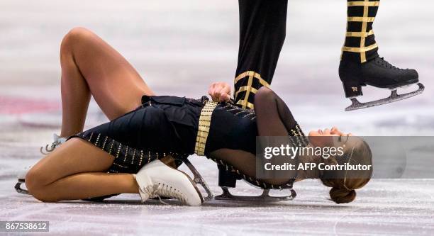 Alisa Agafonova and Alper Ucar of Turkey perform their free dance in the dance competition at the 2017 Skate Canada International ISU Grand Prix...