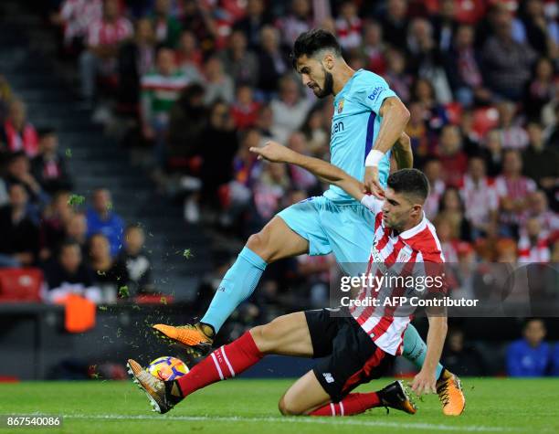 Barcelona's Portuguese midfielder Andre Gomes vies with Athletic Bilbao's Spanish defender Unai Nunez during the Spanish league football match...