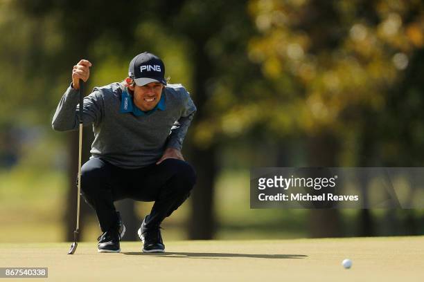 Aaron Baddeley of Australia looks over a putt on the third hole during the third round of the Sanderson Farms Championship at the Country Club of...
