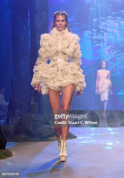 Model walks the runway during the Amato show at Fashion Forward October 2017 held at the Dubai Design District on October 28, 2017 in Dubai, United...