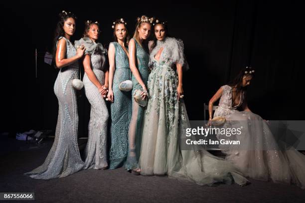 Models backstage ahead of the Amato show during Fashion Forward October 2017 held at the Dubai Design District on October 28, 2017 in Dubai, United...