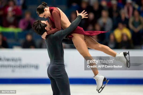 Tessa Virtue and Scott Moir of Canada perform their free dance in the dance competition at the 2017 Skate Canada International ISU Grand Prix event...