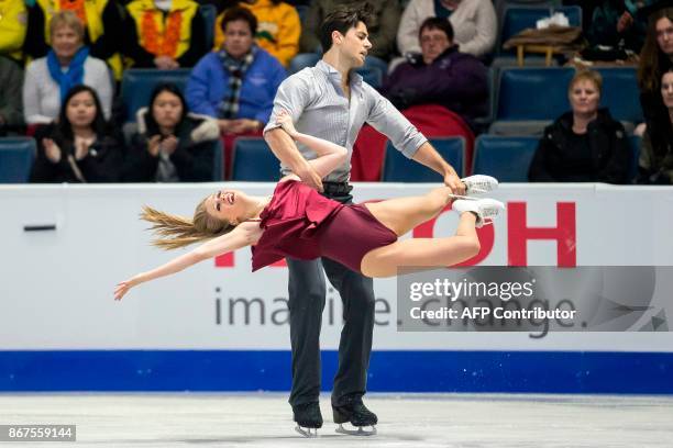 Kaitlyn Weaver and Andrew Poje of Canada perform their free dance in the dance competition at the 2017 Skate Canada International ISU Grand Prix...