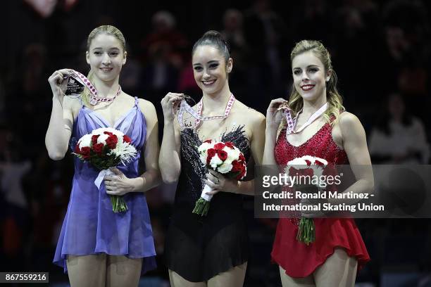 Silver medalist Maria Sotskova of Russia, gold medalist Kaetlyn Osmond of Canada and bronze medalist Ashley Wagner of USA during the ISU Grand Prix...