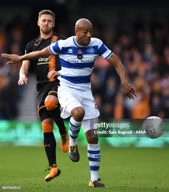 Barry Douglas of Wolverhampton Wanderers and Alex Baptiste of Queens Park Rangers during the Sky Bet Championship match between Queens Park Rangers...