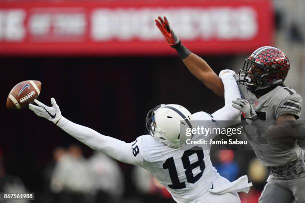 Jonathan Holland of the Penn State Nittany Lions is unable to make the catch as he is fouled by Jerome Baker of the Ohio State Buckeyes in the second...