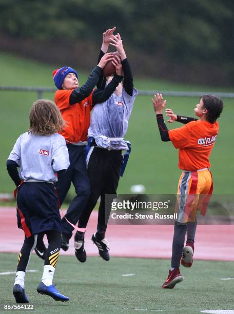 Zach Rivers leaps to make the interception, The CFL-NFL are hosting a flag football regional tournament featuring co-ed teams of 10-11 year olds....