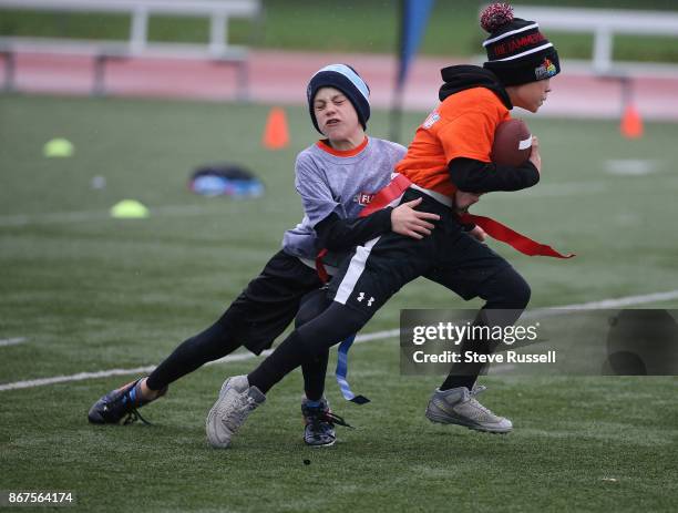 Player tries to reach for a runner's flags. The CFL-NFL are hosting a flag football regional tournament featuring co-ed teams of 10-11 year olds....