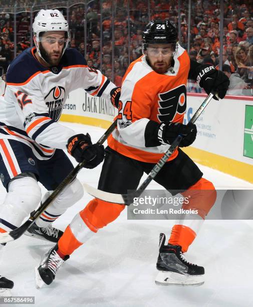 Matt Read of the Philadelphia Flyers battles against Eric Gryba of the Edmonton Oilers on October 21, 2017 at the Wells Fargo Center in Philadelphia,...