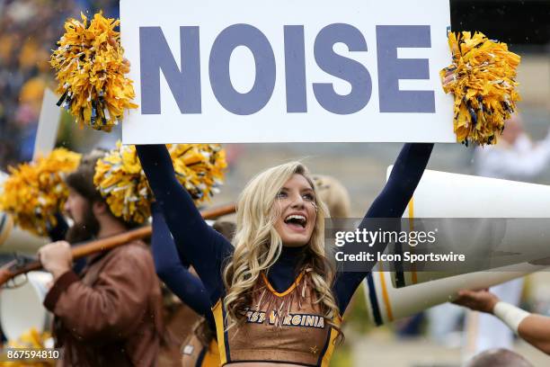 West Virginia Mountaineers cheerleader holds up a sign during the second quarter of the college football game between the Oklahoma State Cowboys and...