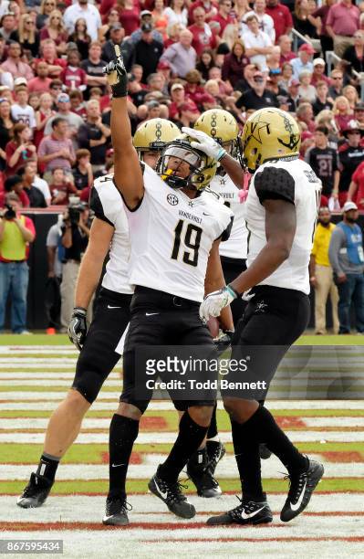 Wide receiver CJ Duncan of the Vanderbilt Commodores is congratulated after scoring a touchdown against the South Carolina Gamecocks at...