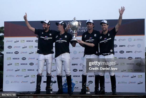 Players of Ellerstina hold up the trophy after winning the final match between Ellerstina and Alegria during the Hurlingham Polo Open 2017 at...