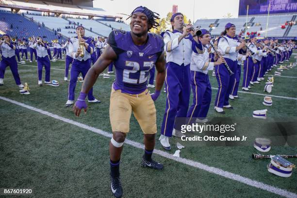Tailback Lavon Coleman of the Washington Huskies celebrates with members of the marching band after the game against the UCLA Bruins at Husky Stadium...